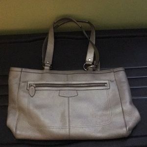 Silver Coach bag with small checkbook. 🙂